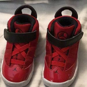 Children’s red and black Jordan’s.